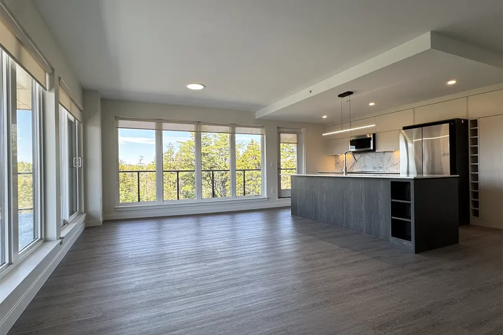 Shiraz Gardens apartment kitchen showing balcony with views of trees and pond